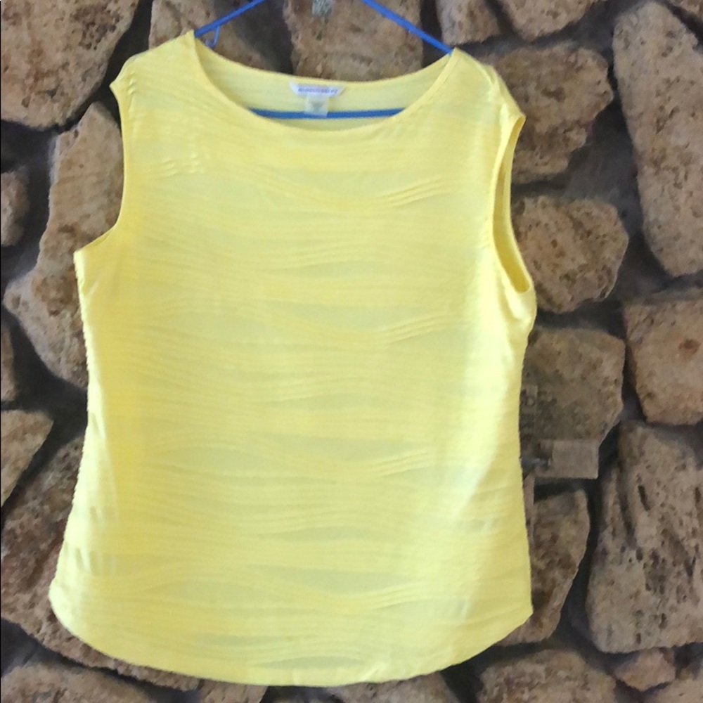 Yellow shirt with line designs.